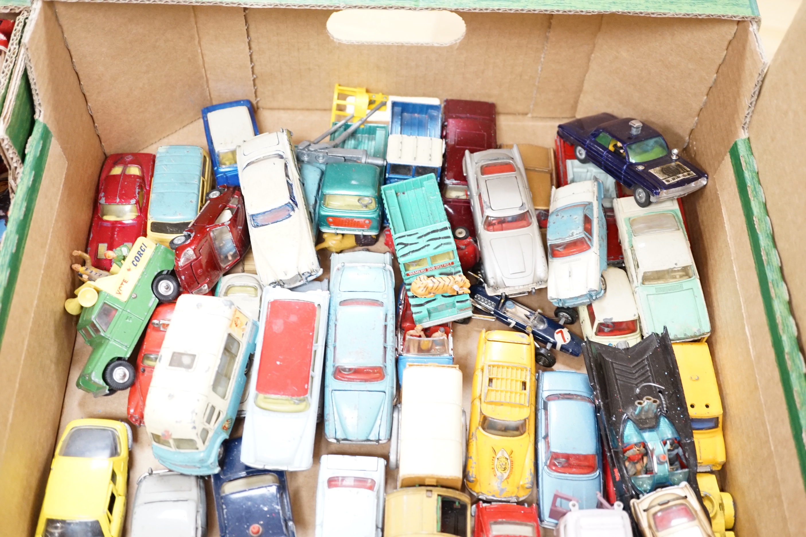 A collection of diecast vehicles by Corgi Toys, Dinky, Spot-On, Matchbox, etc. including 38, corgi toys; a Batmobile, a gold James Bond Aston Martin, a Man From UNCLE Oldsmobile, etc. 18 Husky Toys, ten Dinky Toys, etc.